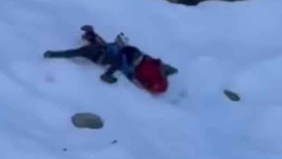Hikers lose their footing and slide down the mountainside